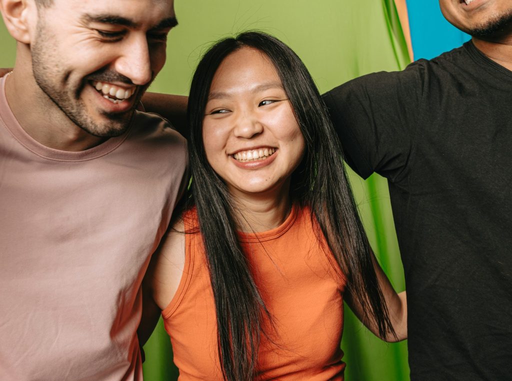 Three friends laughing together